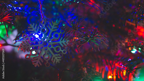 Christmas decorations at christmas tree with blurred RGB lights
