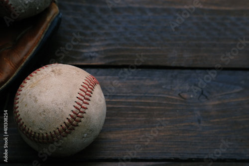 Baseball on wood background for sport copy.
