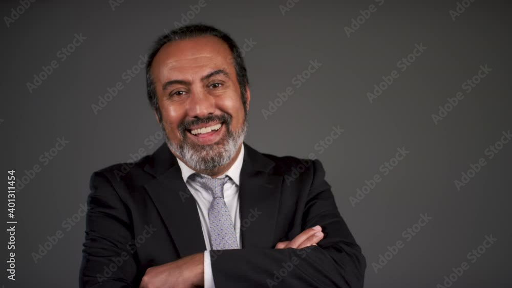 Pull Focus of Middle Aged Businessman Folding Arms and Smiling Pull Focus of Middle Aged Businessman Folding Arms and Smiling