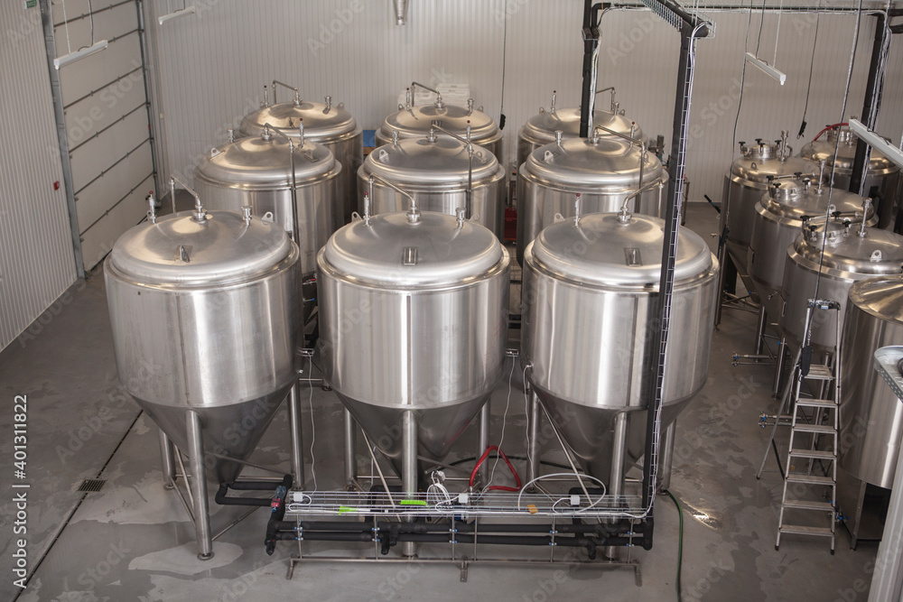 Metal beer tanks at beer factory, copy space Metal beer tanks at beer factory, copy space