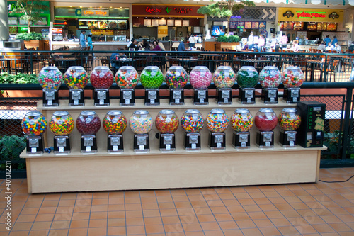 Two rows of colorful gumball machines. Mall of America MOA largest indoor retail and entertainment complex Bloomington Minnesota MN USA photo