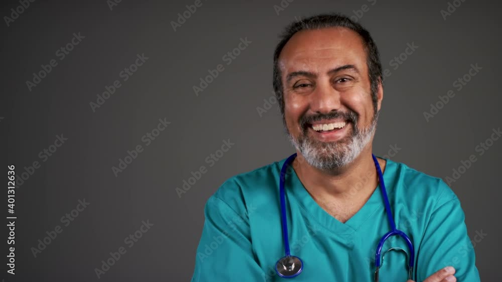 Middle Aged Friendly Doctor Smiling and Folding Arms Portrait Middle Aged Friendly Doctor Smiling and Folding Arms Portrait