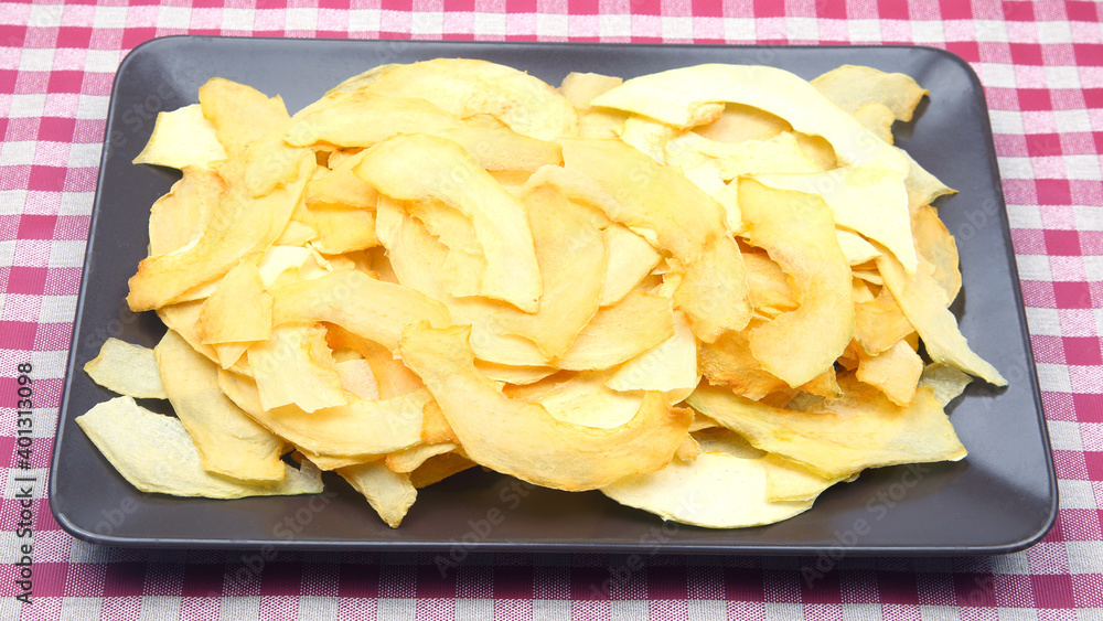 dried pieces of fragrant melon on a plate. vitamin fruit food
