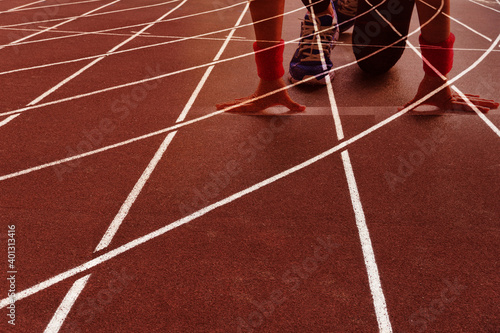 woman with red sport running tract with curve white line lane floor of outdoor stadium background