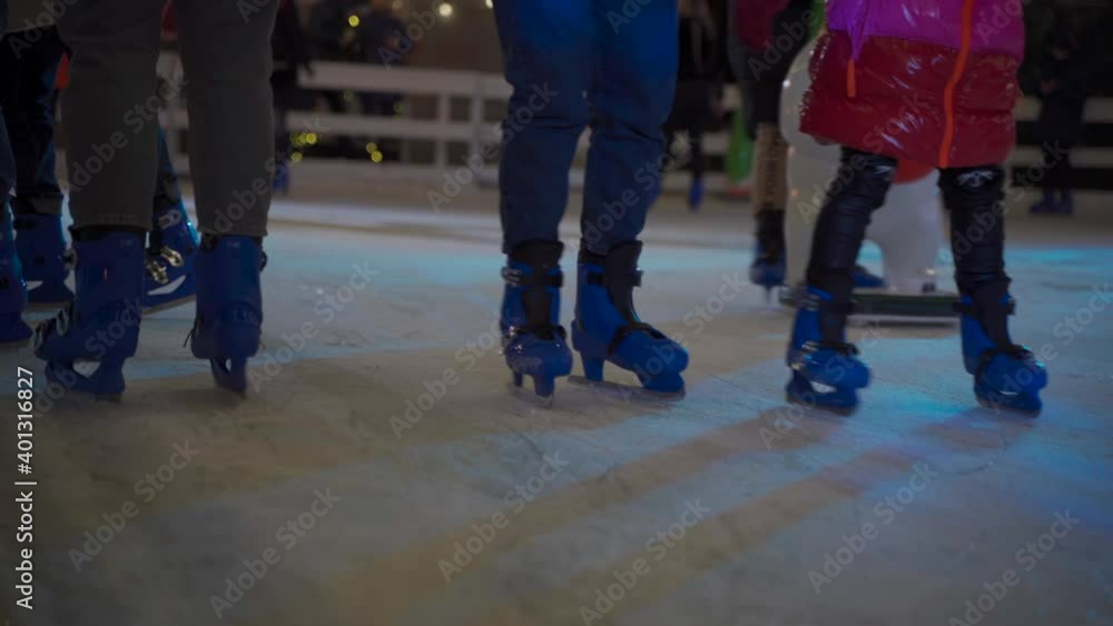 Christmas fair and skating rink in Kiev, Ukraine st. Bankova Street near President office. City ice rink in the evening with beautiful lighting and a lot of happy people skating Christmas fair and skating rink in Kiev, Ukraine st. Bankova Street near President office. City ice rink in the evening with beautiful lighting and a lot of happy people skating