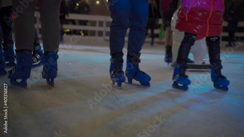 Christmas fair and skating rink in Kiev, Ukraine st. Bankova Street near President office. City ice rink in the evening with beautiful lighting and a lot of happy people skating photo