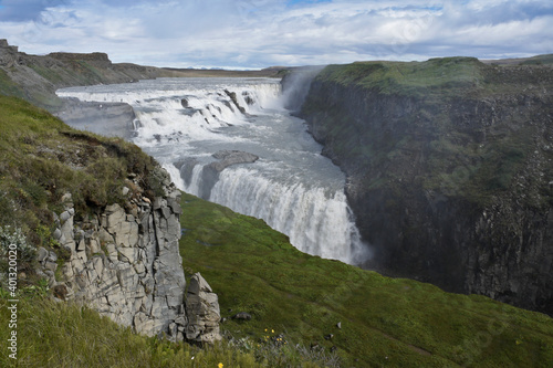 Visitors follow the Trail of Sigridur to an overlook above Gullfoss  Golden Falls  on the Hvita River in Iceland.