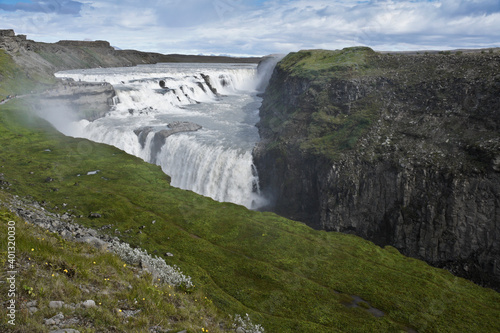 Visitors follow the Trail of Sigridur to an overlook above Gullfoss  Golden Falls  on the Hvita River in Iceland.