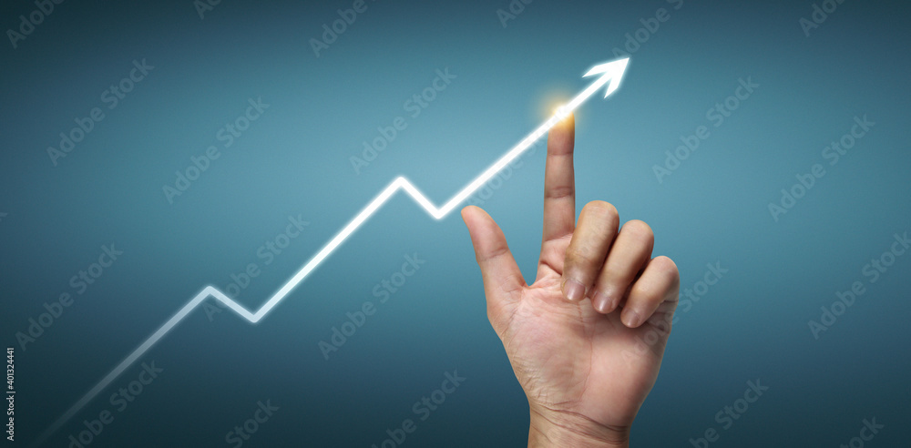 Hand touching graphs of financial indicator and market analysis chart Hand touching graphs of financial indicator and market analysis chart