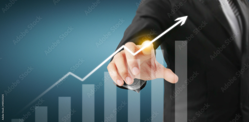 Hand touching graphs of financial indicator and market analysis chart Hand touching graphs of financial indicator and market analysis chart