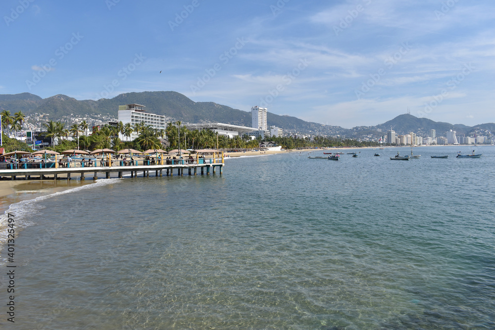 View of the bay of Acapulco with a small pier and some buildings