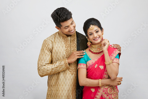 Photography Beautiful happy north Indian couple in traditional dress.