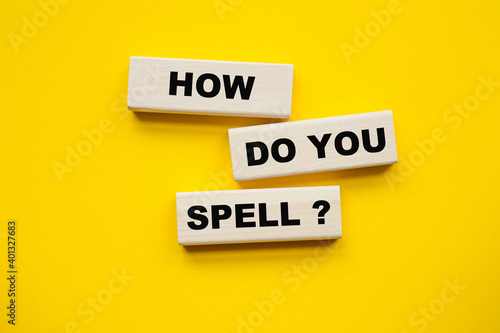 HOW DO YOU SPELL inscription on CUBES , yellow pen on a yellow background. a bright solution for business, financial, marketing concept
