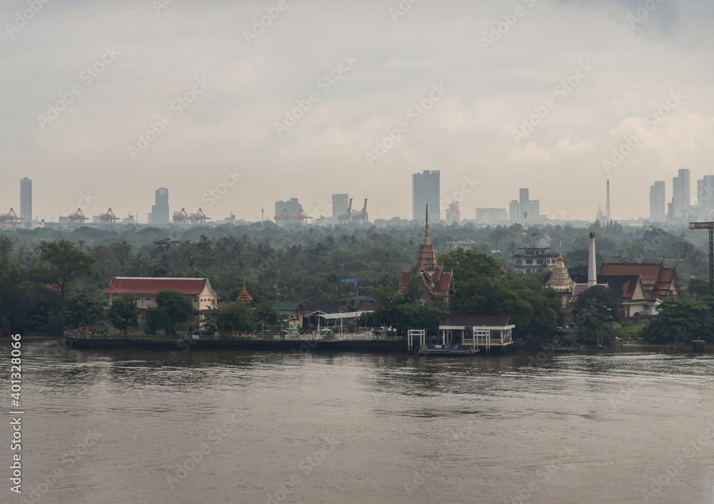 Aerial view Overlooking green area of Bang kachao lung and Bang Krachao Nok Temple Pier with a Chao Phraya River front. Focus and blur.