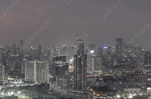 Wallpaper Mural Bangkok, thailand - Dec 23, 2020 : Bangkok downtown cityscape in Business district with bright glowing lights at night give the city a modern style. Dark tone, No focus, specifically. Torontodigital.ca