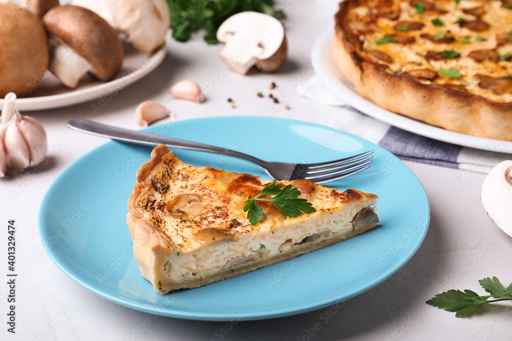 Delicious pie with mushrooms and cheese served on light table Delicious pie with mushrooms and cheese served on light table
