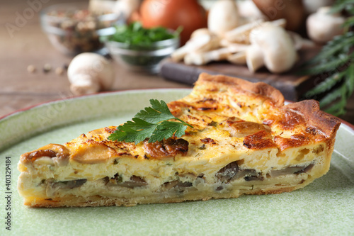 Delicious pie with mushrooms and cheese on plate, closeup