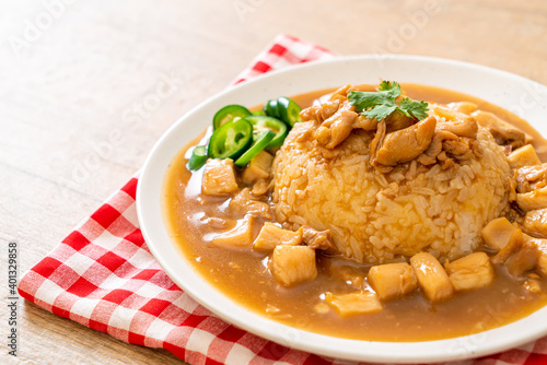 Chicken in brown sauce or gravy sauce with rice