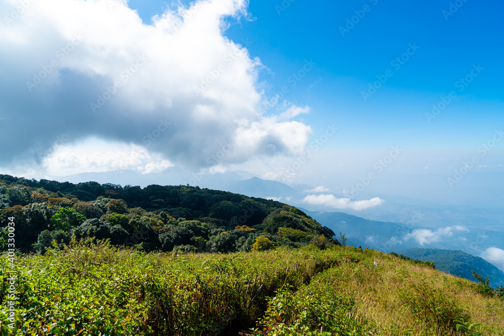 Obraz premium beautiful mountain layer with clouds and blue sky