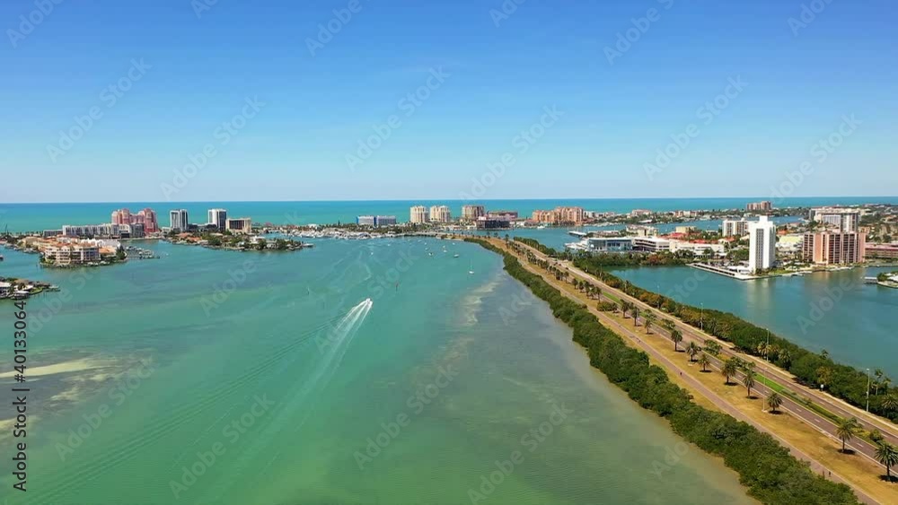 Aerial view of a small yacht sailing in Clearwater Beach in Florida on a summer day. Aerial view of a small yacht sailing in Clearwater Beach in Florida on a summer day.