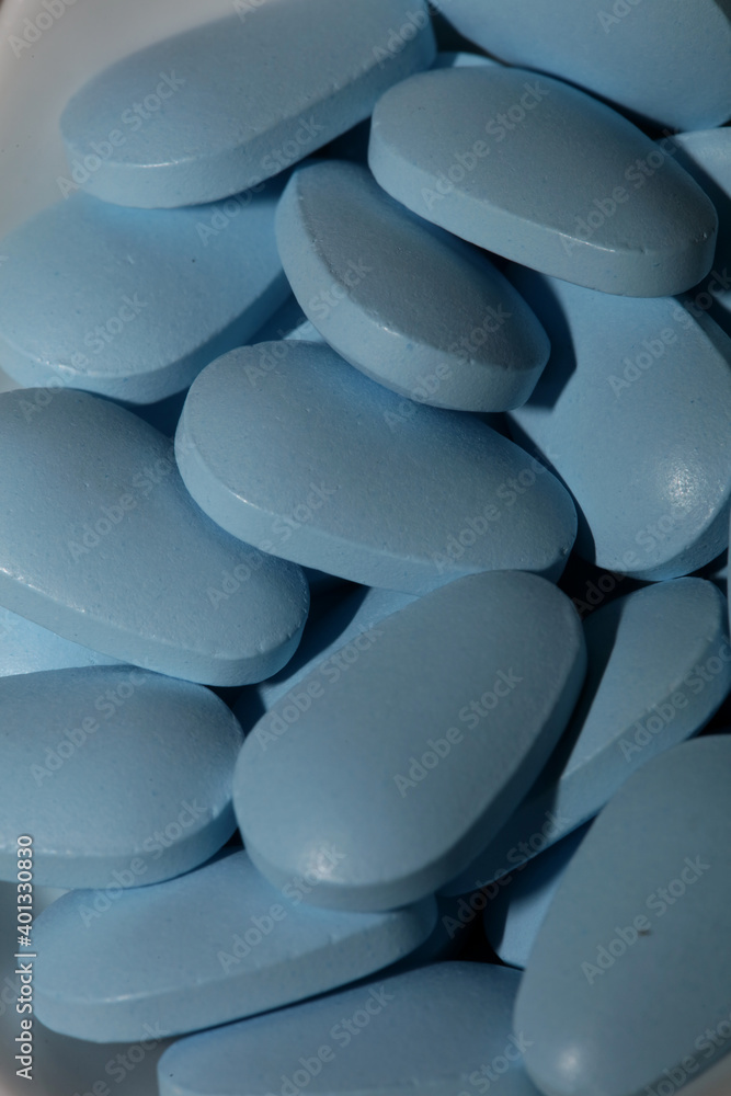 Blue medical pills close up modern background high quality prints Blue medical pills close up modern background high quality prints