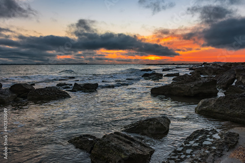 Colorful sunrise on the rocky coast