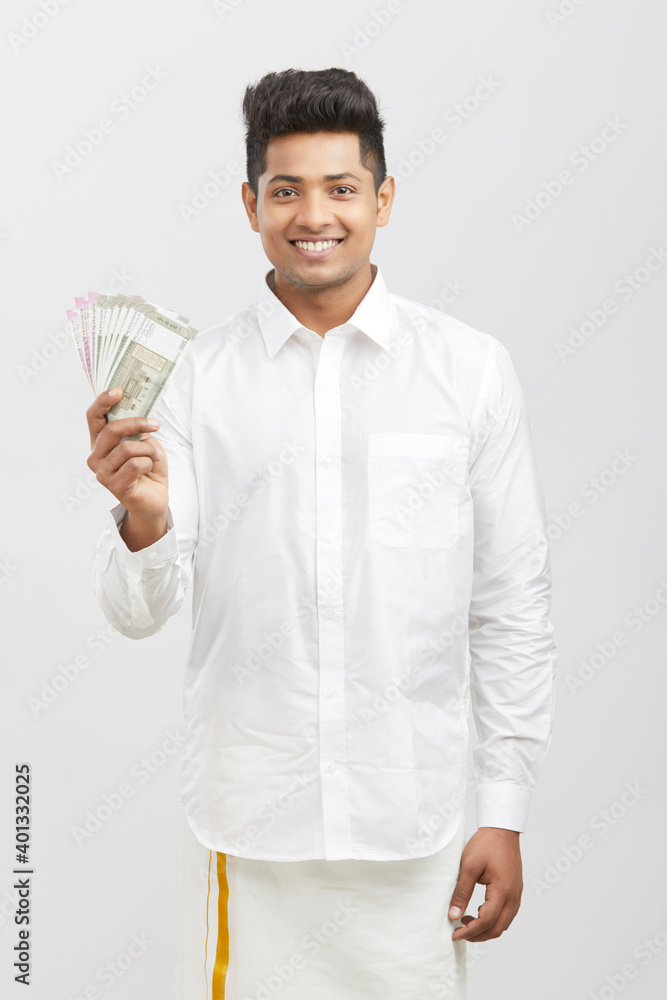 Indian traditional business man with Indian currency on white. Indian traditional business man with Indian currency on white.