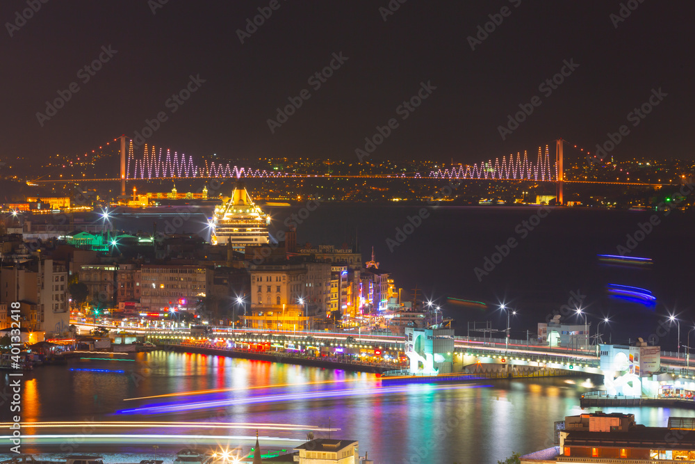 Blue Mosque at night with golden illumination, wide view of Istanbul in ...