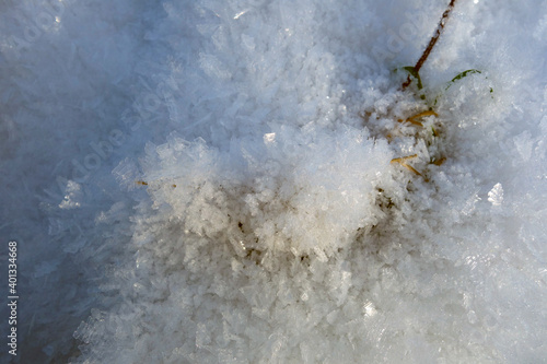 Beautiful snow crystals in the picturesque nature in the winter season © tonysk