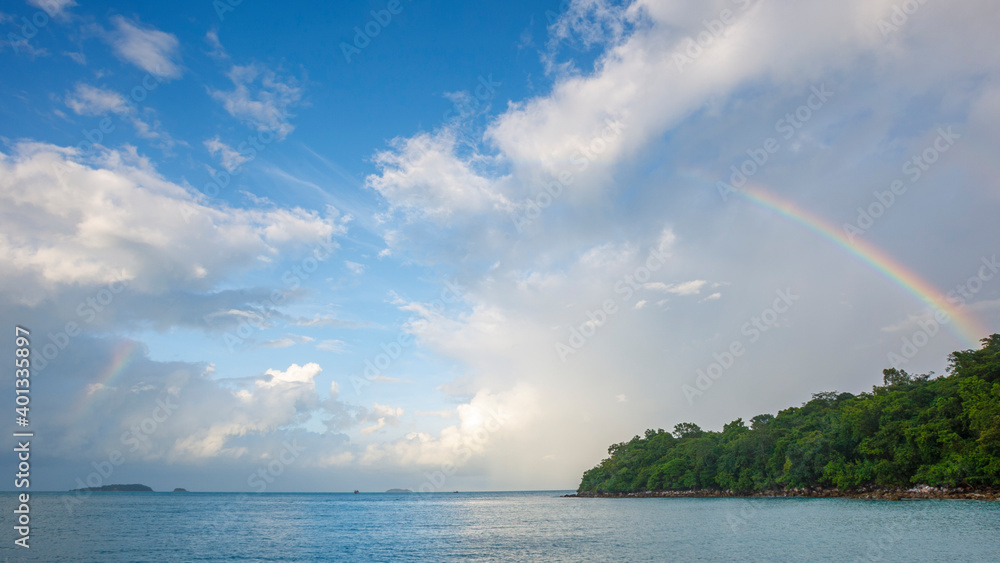 beautiful rainbow in the sky on the tropical beach after the rain beautiful rainbow in the sky on the tropical beach after the rain