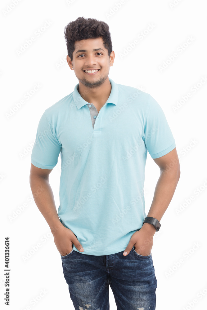Smiling attractive young man standing over white. Smiling attractive young man standing over white.