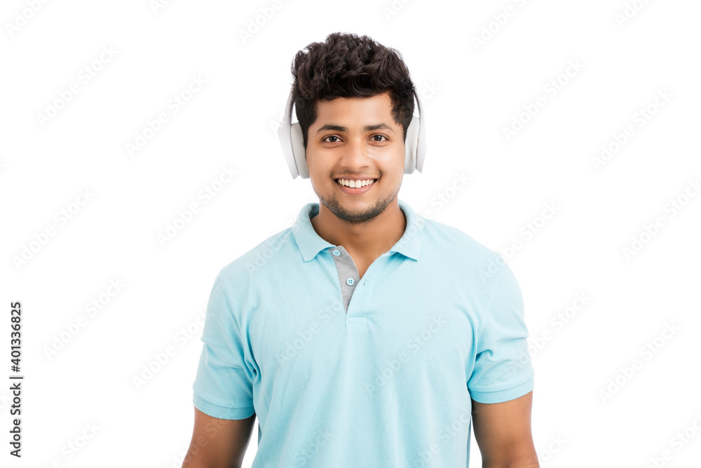 Cheerful young man with headphones isolated on white. Cheerful young man with headphones isolated on white.