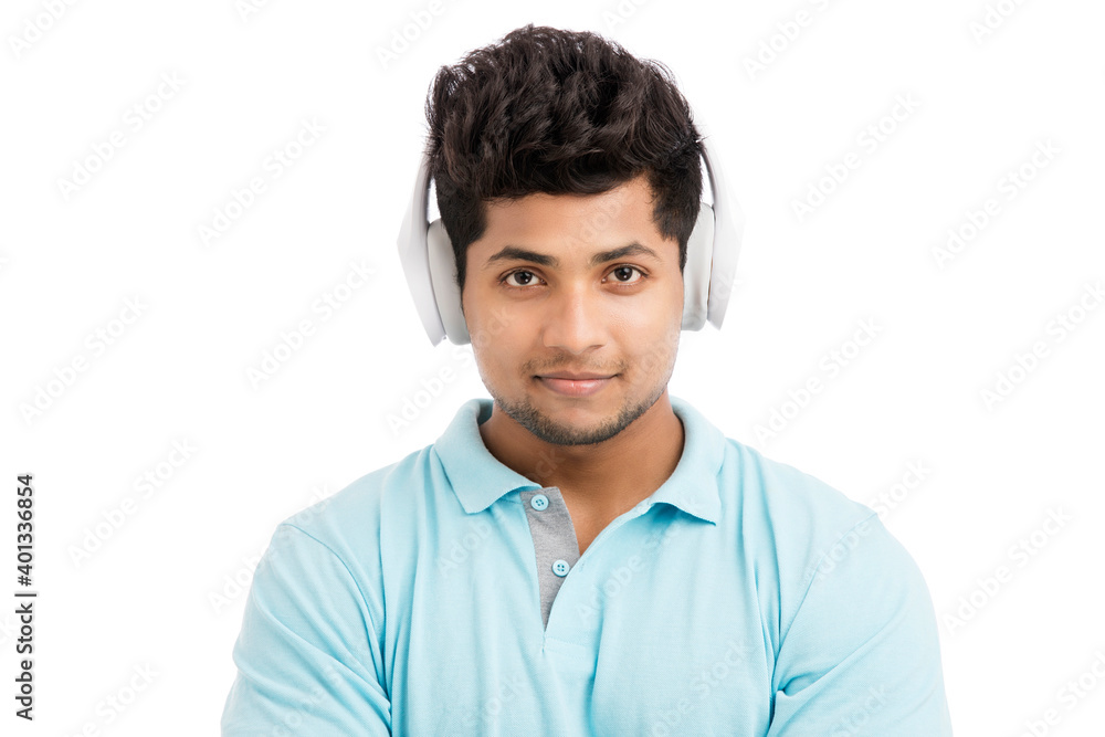Cheerful young man with headphones isolated on white. Cheerful young man with headphones isolated on white.