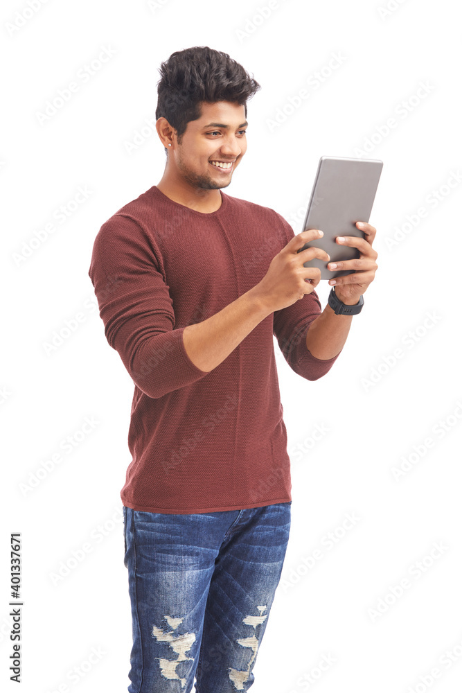Indian young man using tablet for video calling on white. Indian young man using tablet for video calling on white.