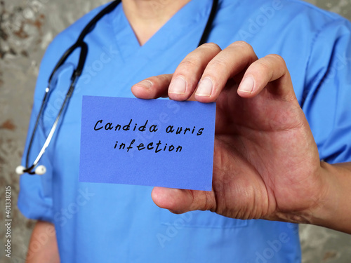 Health care concept meaning Candida auris infection with inscription on the piece of paper. photo