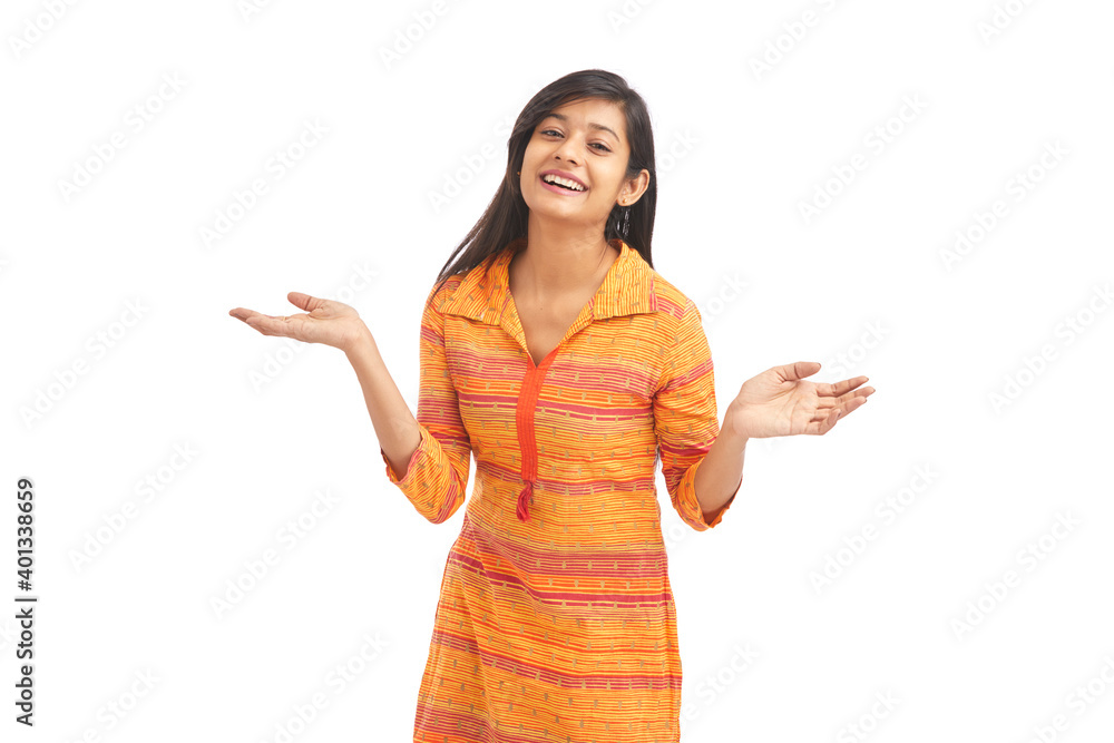 Attractive cheerful young women greetings against white background. Attractive cheerful young women greetings against white background.