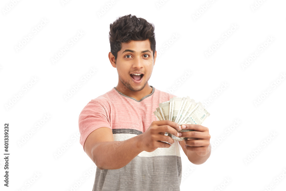 Attractive young Indian cheering with Indian rupees on white. Attractive young Indian cheering with Indian rupees on white.