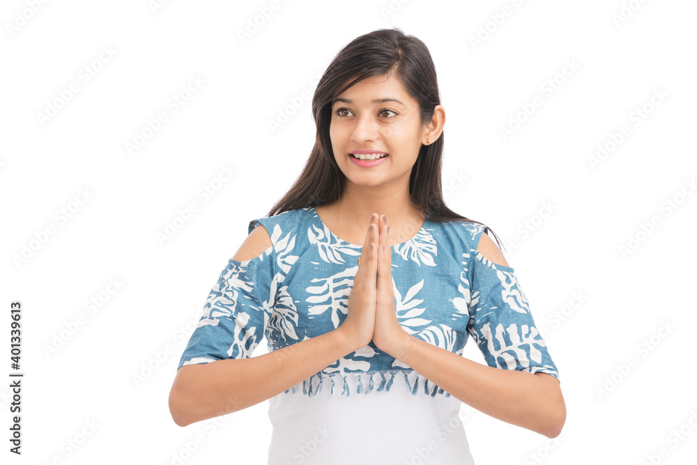 Pretty Indian young woman greeting on white. Pretty Indian young woman greeting on white.