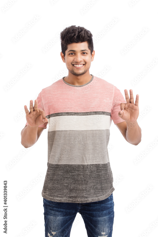 Happy Indian young man making super ok gesture isolated on white. Happy Indian young man making super ok gesture isolated on white.