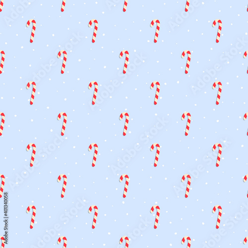 Seamless candy pattern with snow on blue bakground on Christmas and Happy New Year