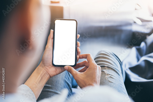 cell phone blank white screen mockup.woman hand holding texting using mobile on desk at office.background empty space for advertise.work people contact marketing business,technology