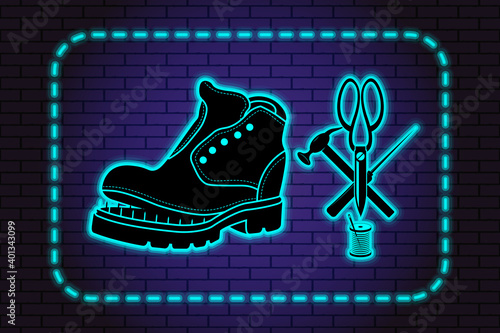 Shoe repair service. Neon symbol in old retro style. On background of brick illuminated wall