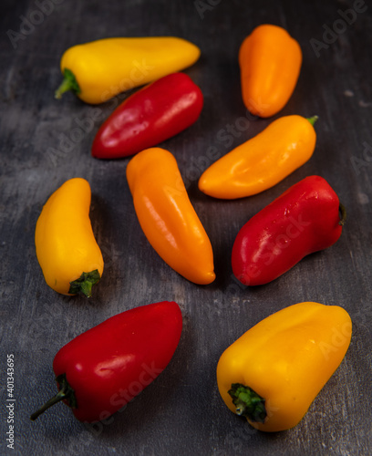 Assorted ripe multi-colored baby peppers, red, orange and yellow, France