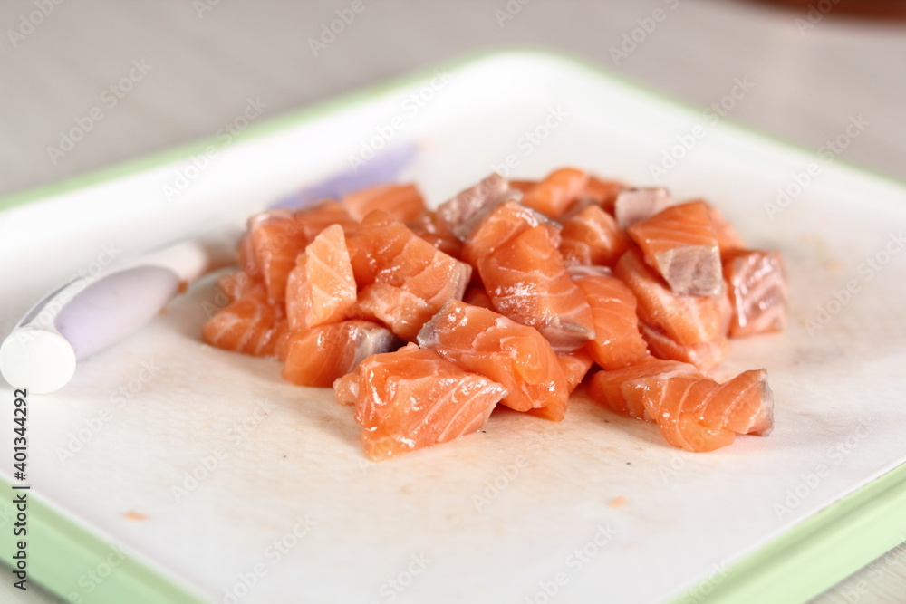 Diced salmon fillet. Making Salmon in Puff Pastry Series. Diced salmon fillet. Making Salmon in Puff Pastry Series.