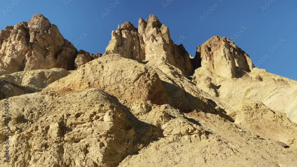 Interesting rocks at the Golden Canyon at sunset at Death Valley National Park, CA, USA. Slide left to right. Interesting rocks at the Golden Canyon at sunset at Death Valley National Park, CA, USA. Slide left to right.