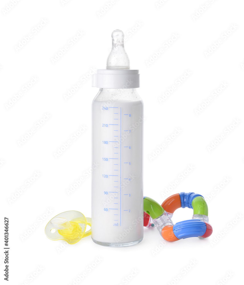 Bottle of milk for baby and accessories on white background Bottle of milk for baby and accessories on white background