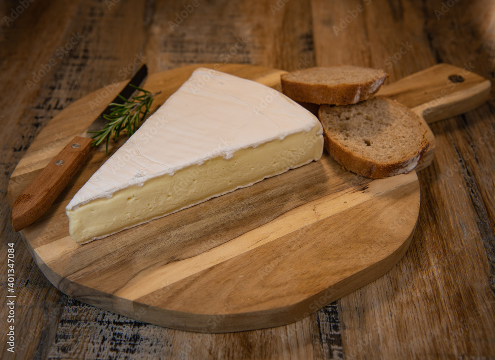 Brie cheese triangle with bread and parsley, High quality photo