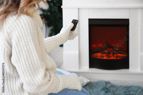 Young woman sitting near el...