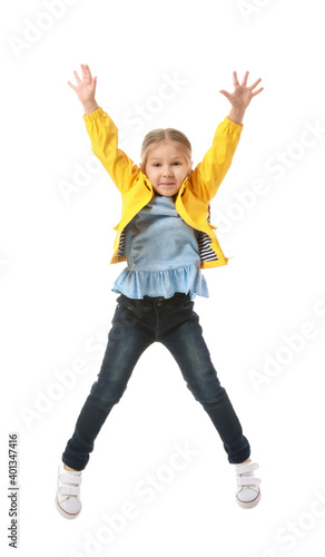 Jumping little girl on white background