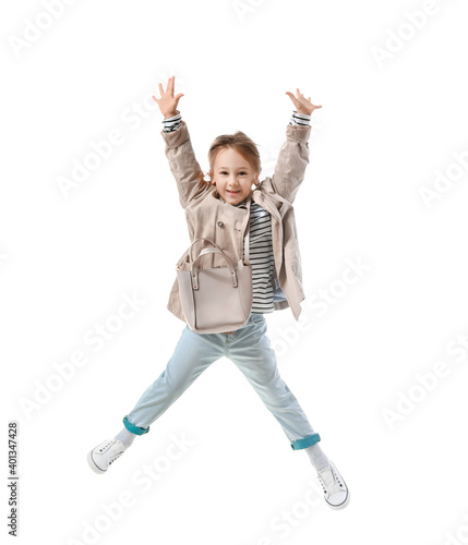 Jumping little girl on whit...